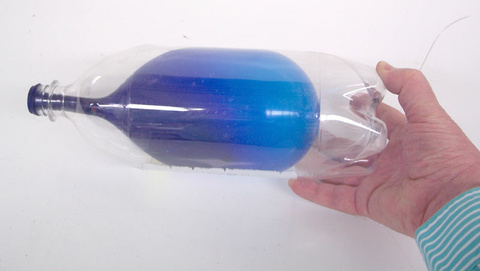 inflated balloon in a bottle
