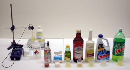 bottles with samples of liquid, pH Meter and Probe, pH Buffer Solution (Standardizer), Stirring Rod, Distilled Water in Wash Bottle, Lab Jack
