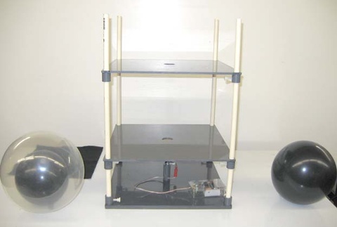 black balloons, framework with apparatus on bottom