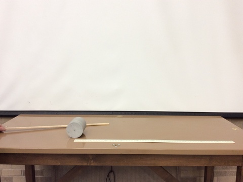 rulers, cylinder on a table