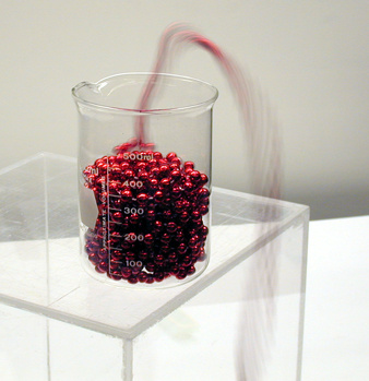 Bead Strings coming out of a beaker