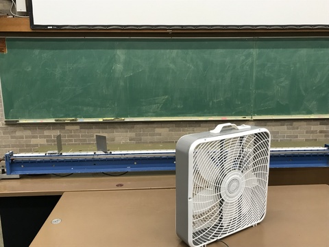 fan on a table, air track, device on air track