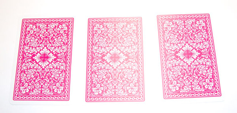 three playing cards face down