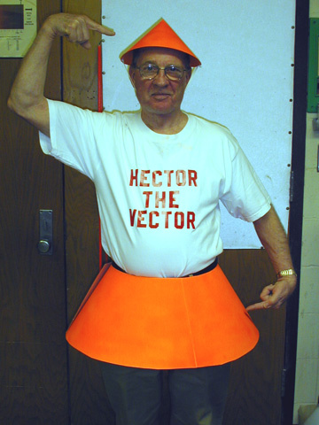 man with Hector the Vector tshirt, pointing to orange hat, costume