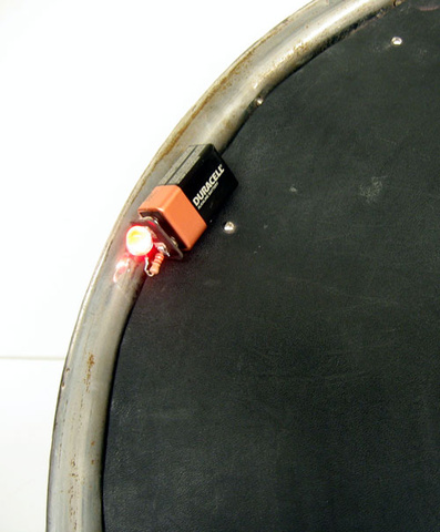 battery with LED unit closeup on wheel