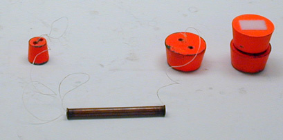 String through tube with 2 unequal masses