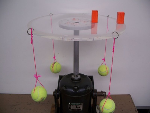 tennis ball on strings fastened to an air table plate, rotator 