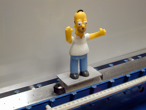 Homer figure on an air track