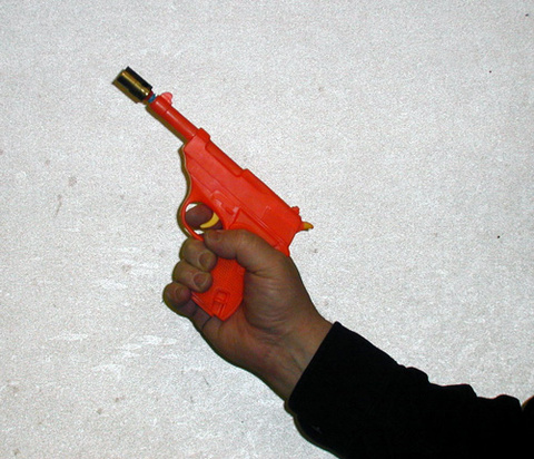 person holding a Short Range Spring Gun