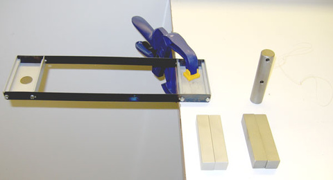 Inertial balance, C-clamp, additional mass