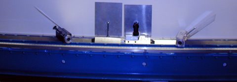 Air track with cars, metal plates (closeup)