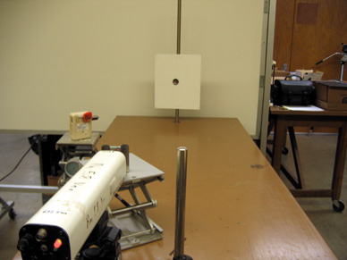 Laser, beam splitter, Radio shack speaker amplifier with photocell, mirror with magnetic backing on a table, metal "wall".