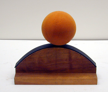 ball with offset center of mass on a negatively curved surface