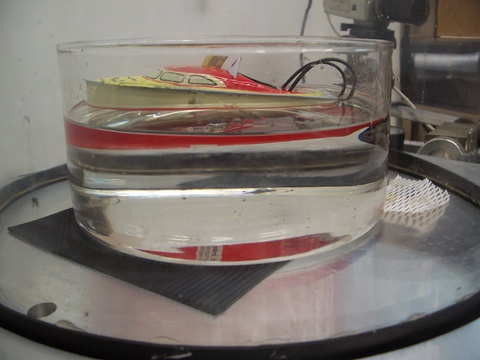 Toy Boat floating in a dish 