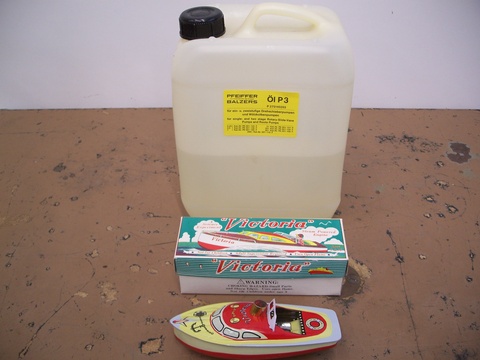 Toy Boat and Clear Vacuum Pump Oil 