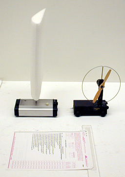 Pasco cart with attached airplane wing and Plexiglas Stick with a sheet of stiff paper attached