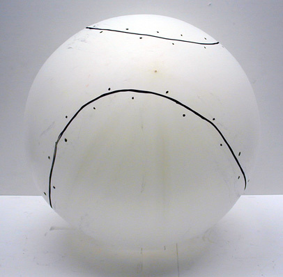 balloon with baseball stitches drawn on it