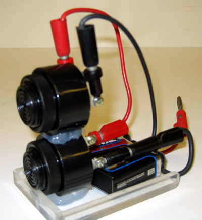 6 volt battery with attached doorbell.