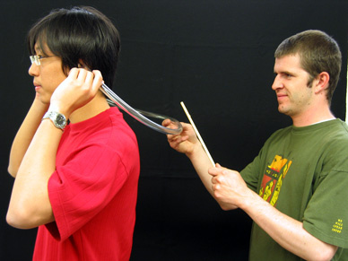 Flexible Plastic Tubing with the Center Marked, and Small Wooden Dowel Rod