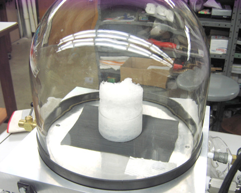 Vacuum pump and bell jar setup