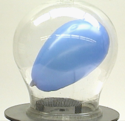 Vacuum pump and bell jar, black perforated metal stand, balloon