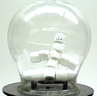 Vacuum pump and bell jar, black perforated metal stand, marshmallows.