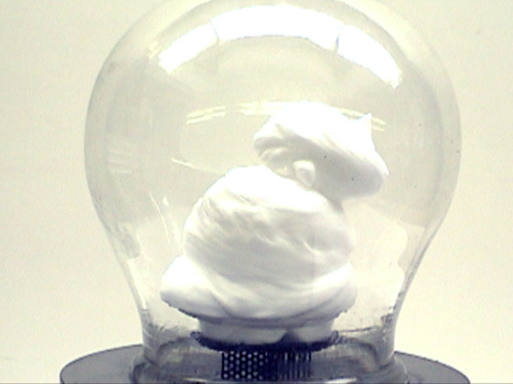 Vacuum pump and bell jar, black perforated metal stand, shaving cream