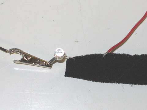Alligator clip lead, LED, conducting foam (close-up)