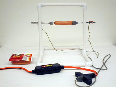 Fork assemblies on sliding rod, hot dogs, switch, power cord