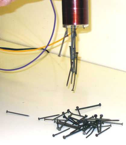 Electromagnet coil with iron core, Variac, nails