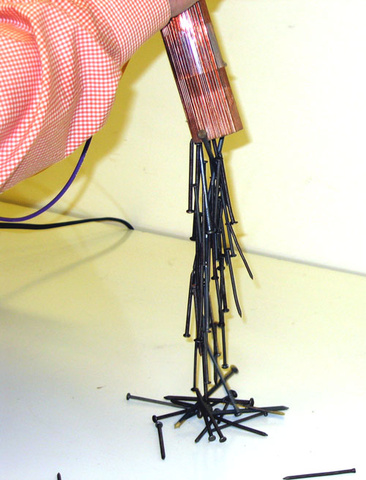Electromagnet coil with iron core, Variac, nails