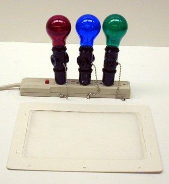 Power strip with red, blue, and green bulbs with switches, White Paper Screen