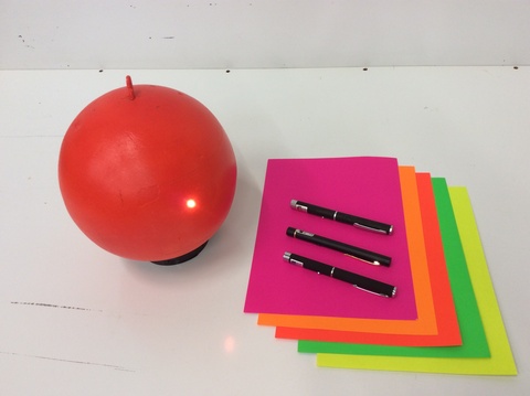 Red Ball, Lights, and Colored Paper