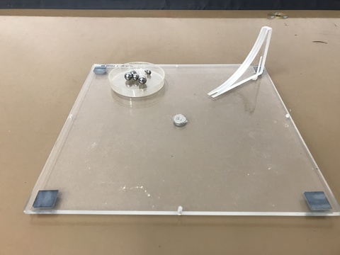 Overhead plate with ball bearings.