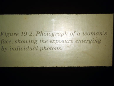 Figure 19.2 Photograph of a woman's face, showing the exposure emerging by individual photons