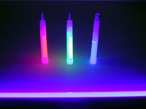 three light sticks under black light