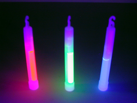 three light sticks under black light