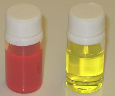 Red and Yellow Liquid in 2 Bottles