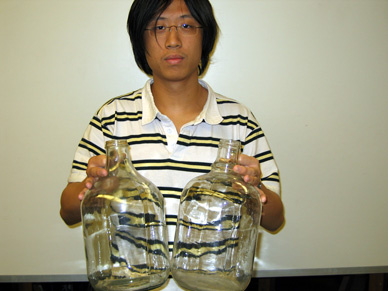 Student and One Gallon Jugs