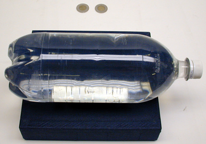 8" X 8" X 2" high block, 2 L bottle full of water, 2 large coins.