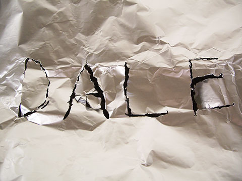 Aluminum foil with "Dale" cut into it