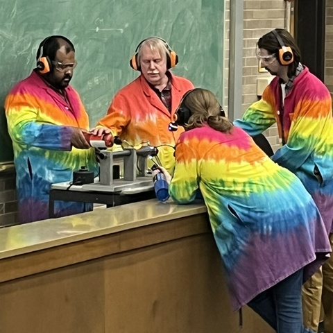 students and Dale Stille in colorful lab coats begin pulse jet engine demo