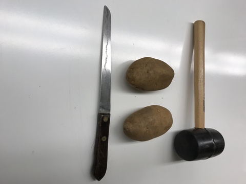 rubber mallet, two potatoes, knife